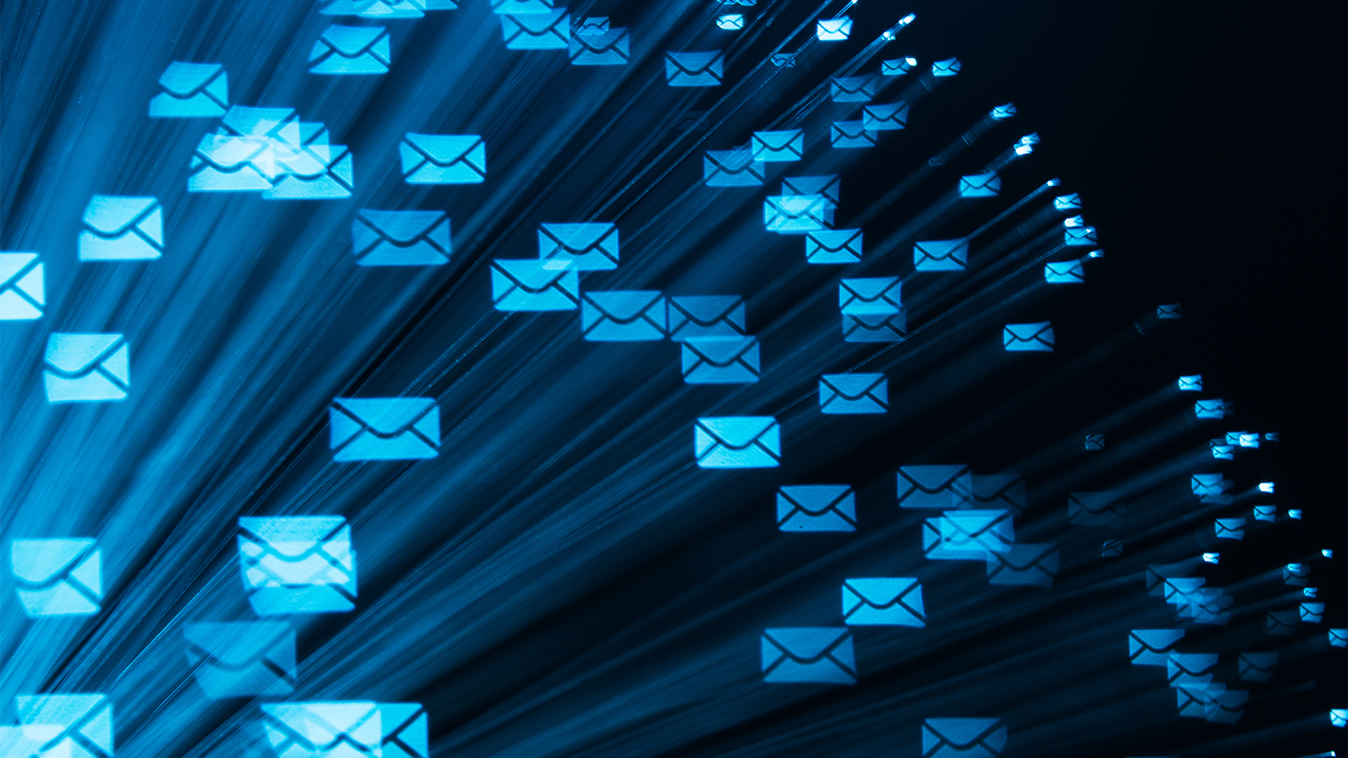 Email security concept image showing a flurry of digitized mail symbols.