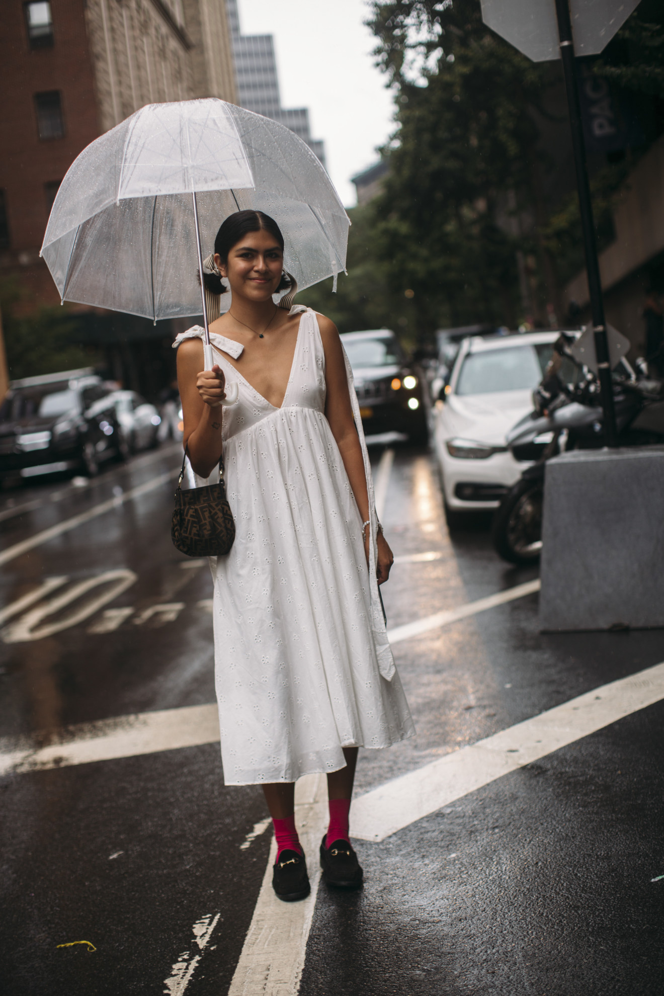 woman wearing white dress, red socks, and loafers