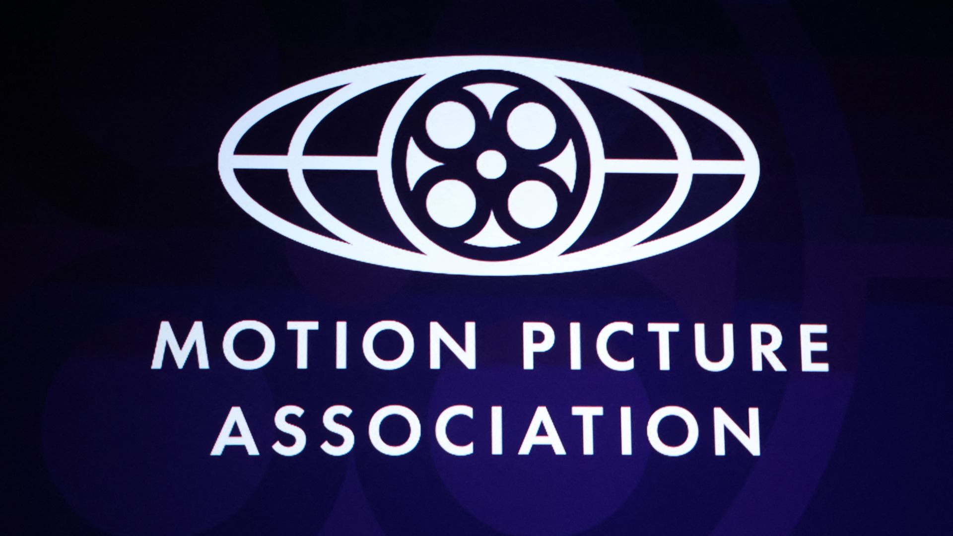 The Motion Picture Association (MPA) logo is displayed on screen during &quot;State of Industry&quot; presentation at The Colosseum at Caesars Palace at CinemaCon 2025 in Las Vegas, Nevada, on April 1, 2025. 