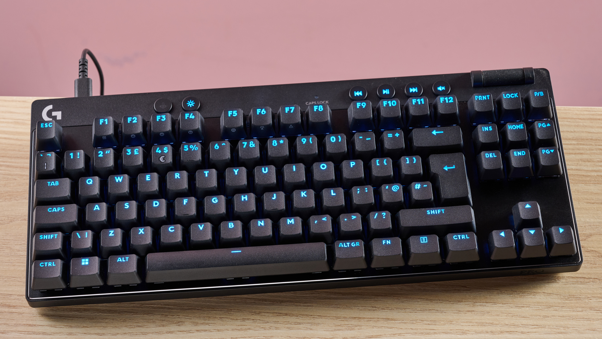 Logitech Pro X TKL Rapid on table with pink background