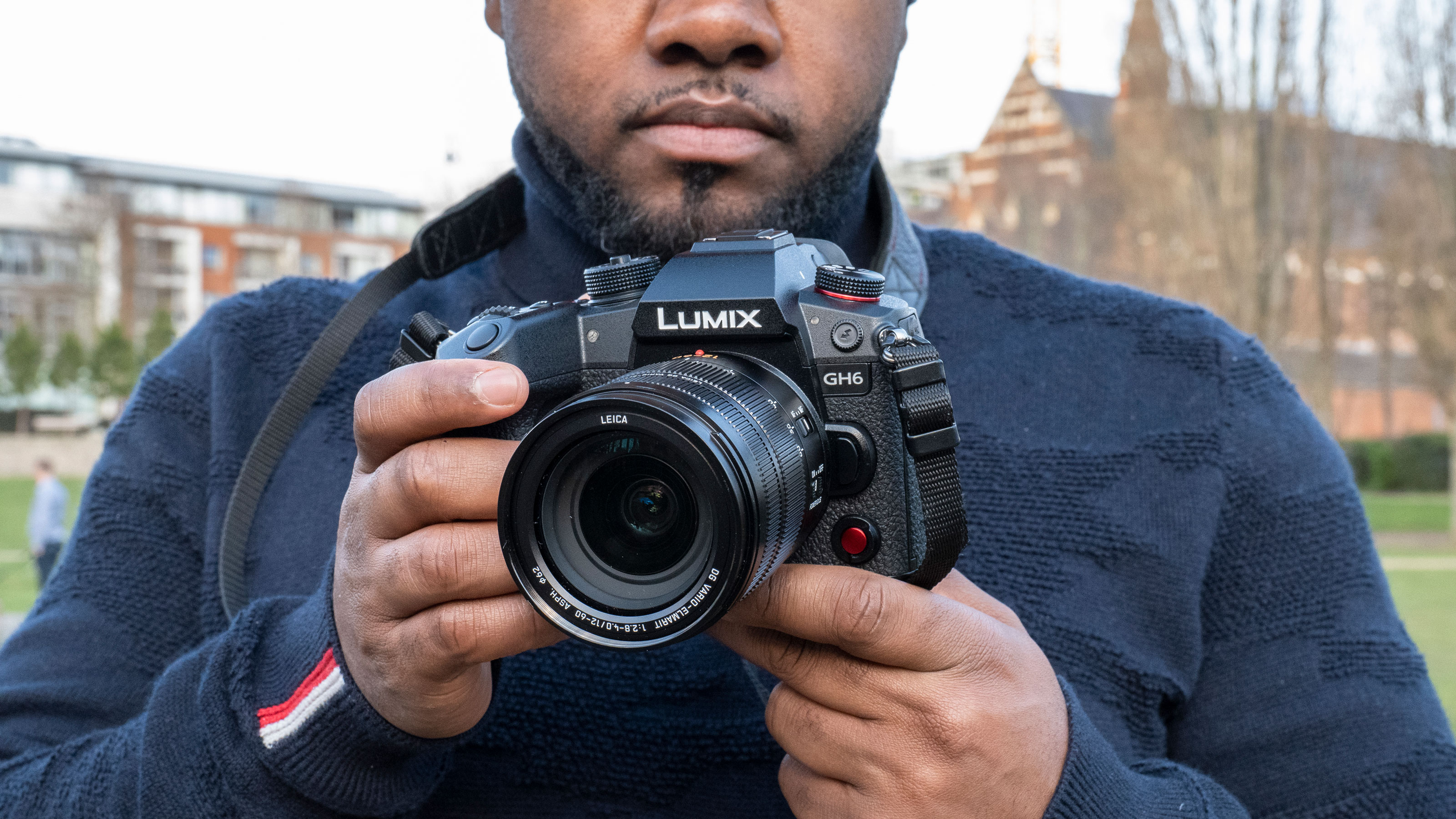 Our reviewer holding the Panasonic Lumix GH6 filmmaking camera