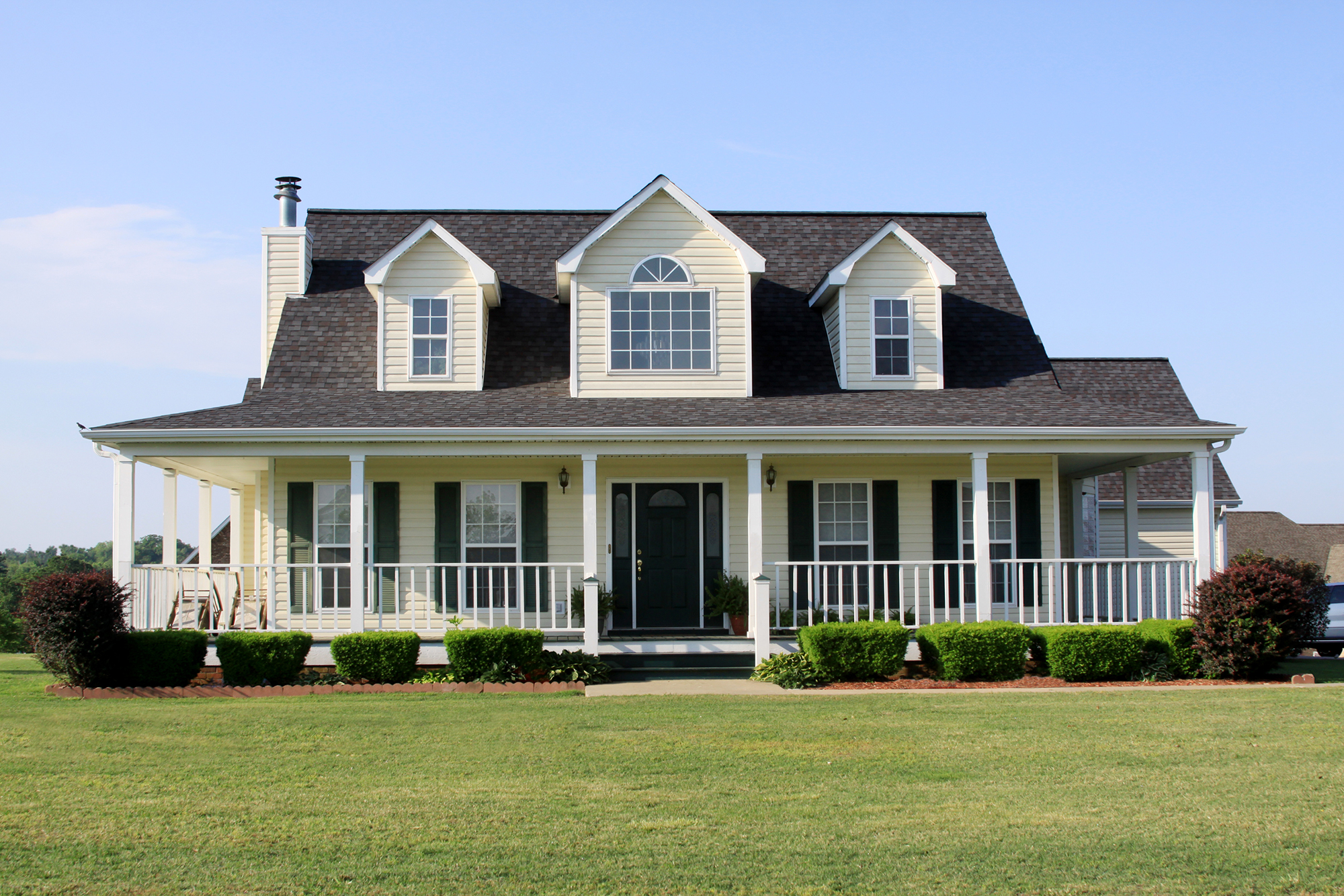 Creamy yellow country house exterior