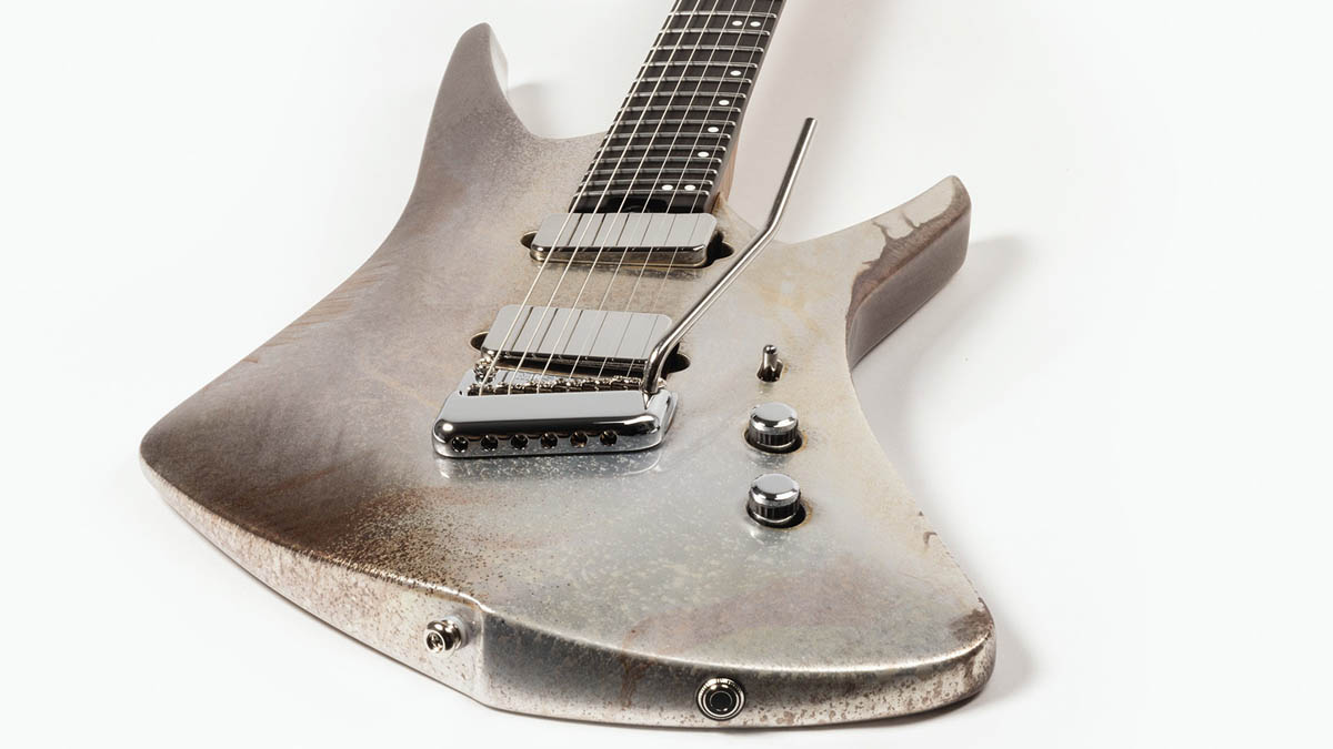 The Ernie Ball Music Man Kaizen Gallium has a custom aged metallic finish, making Tosin Abasi's signature electric guitar look like an alien artefact
