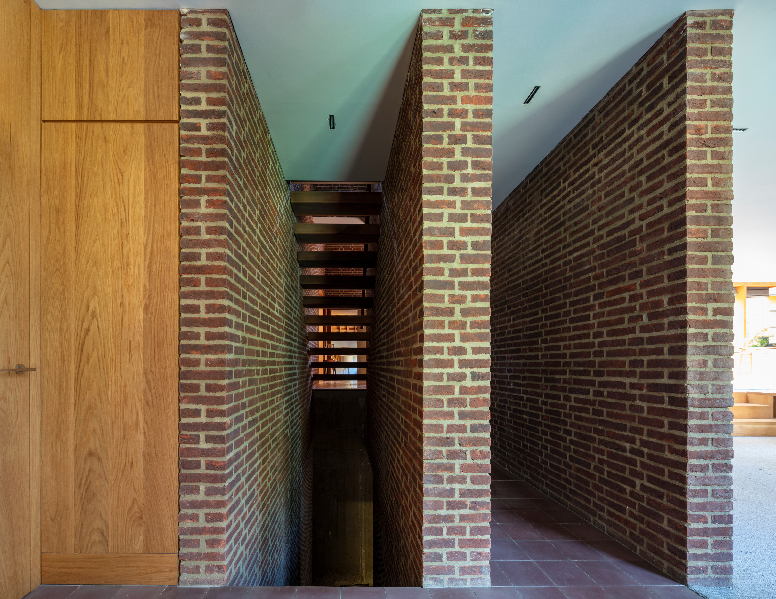 Internal finishes focus on exposed brick, timber and terracotta flooring