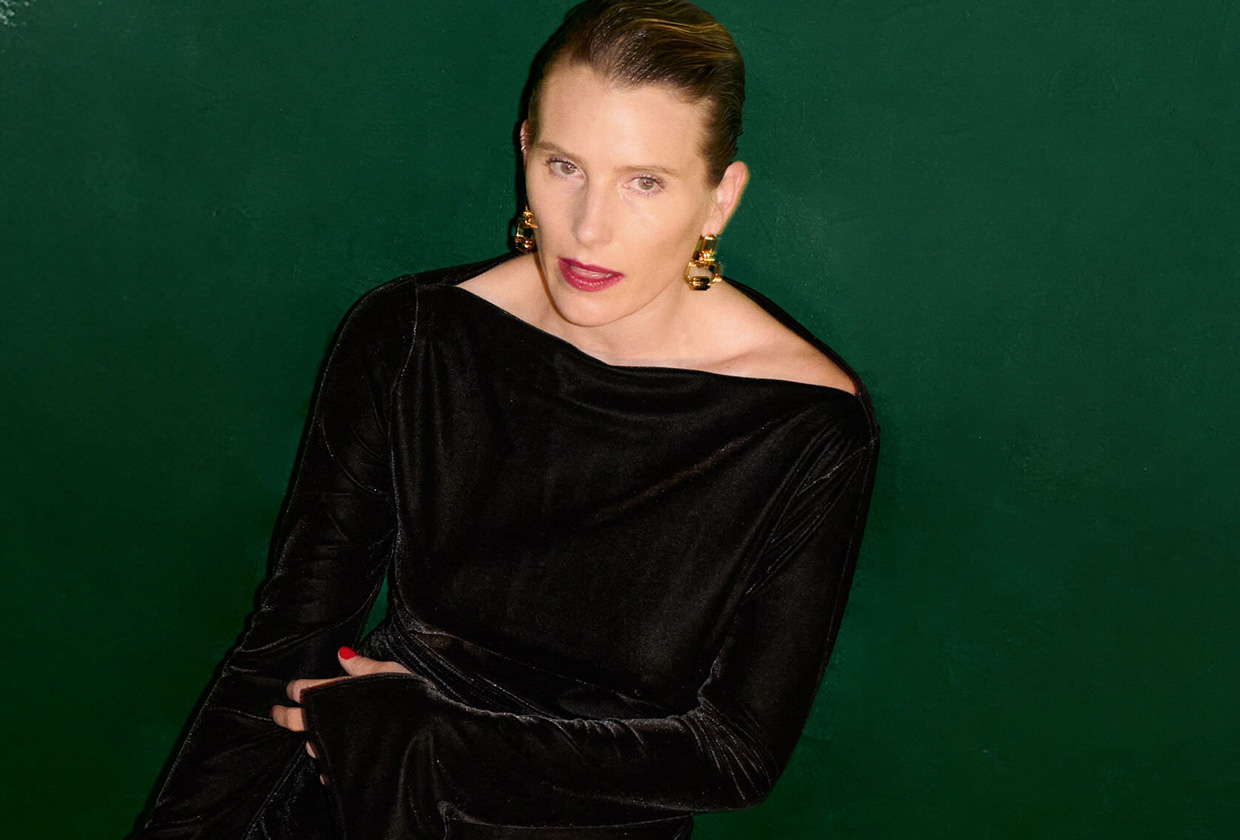 Dree Hemingway in a lookbook photo for Reformation's new jewelry collection with Clare Waight Keller wearing a velvet black dress and gold jewelry.