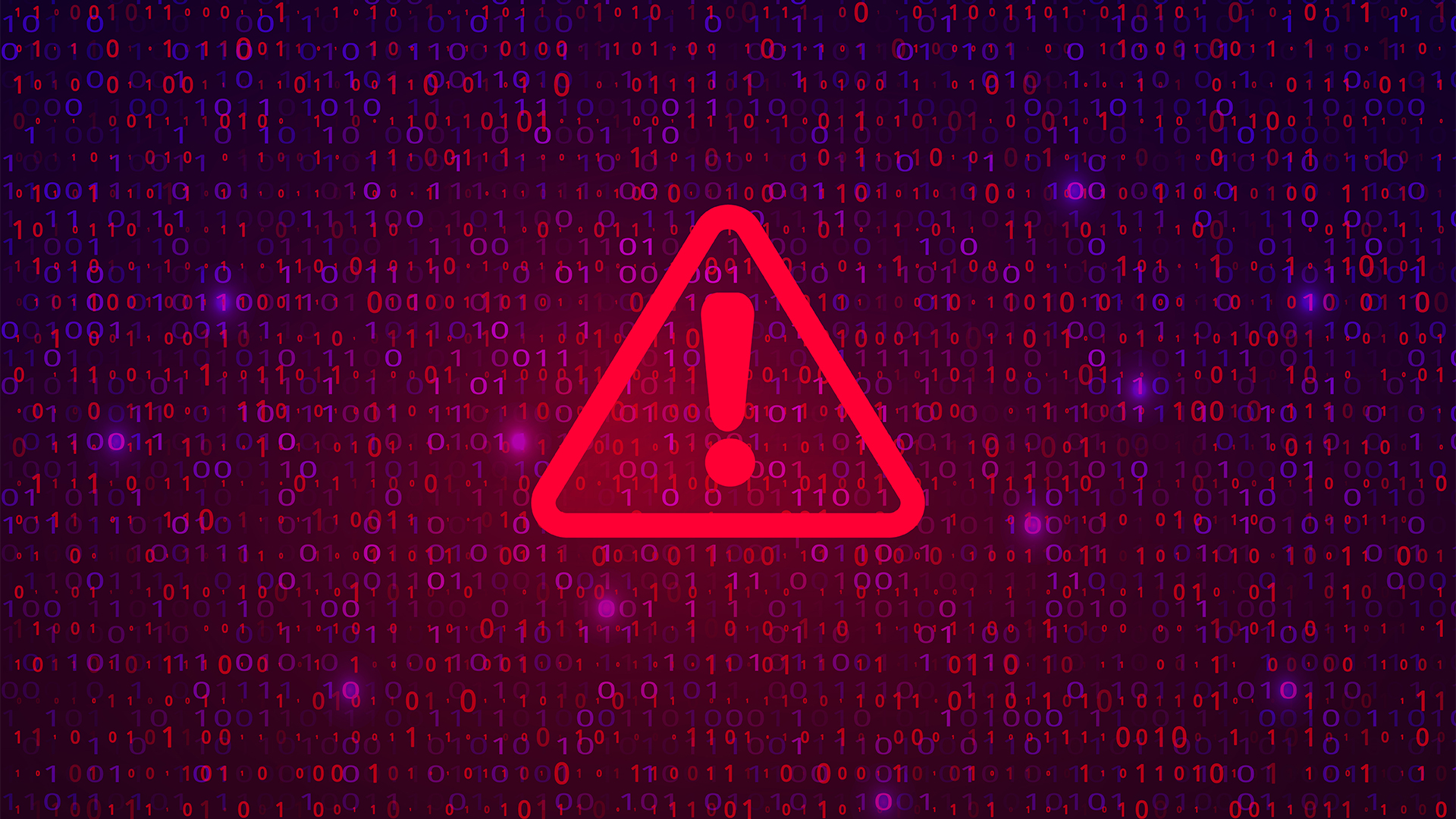 Ransomware concept image showing a warning symbol in red with binary code in background.