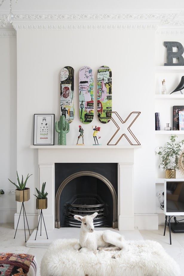 White living room with fireplace and eclectic decor