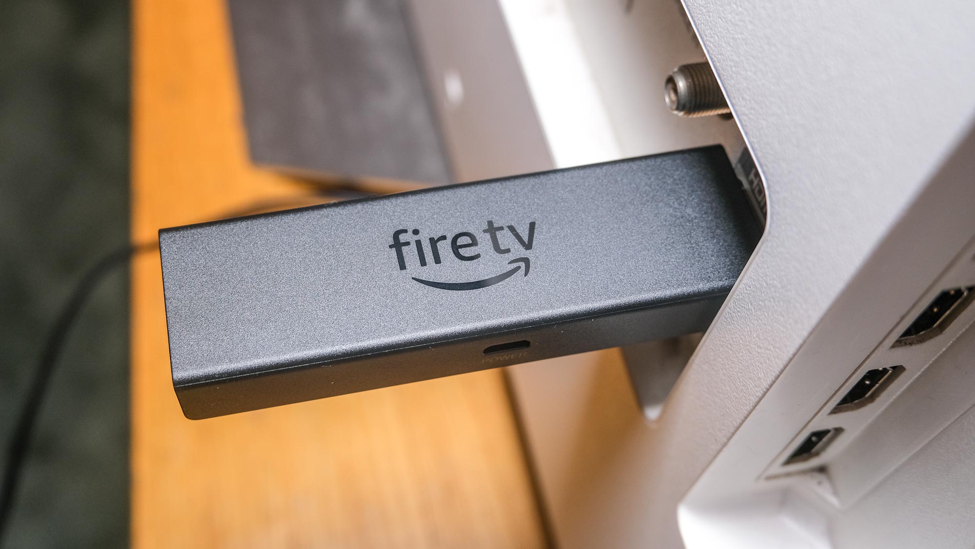 Amazon Fire TV Stick 4K Max plugged horizontally into TV