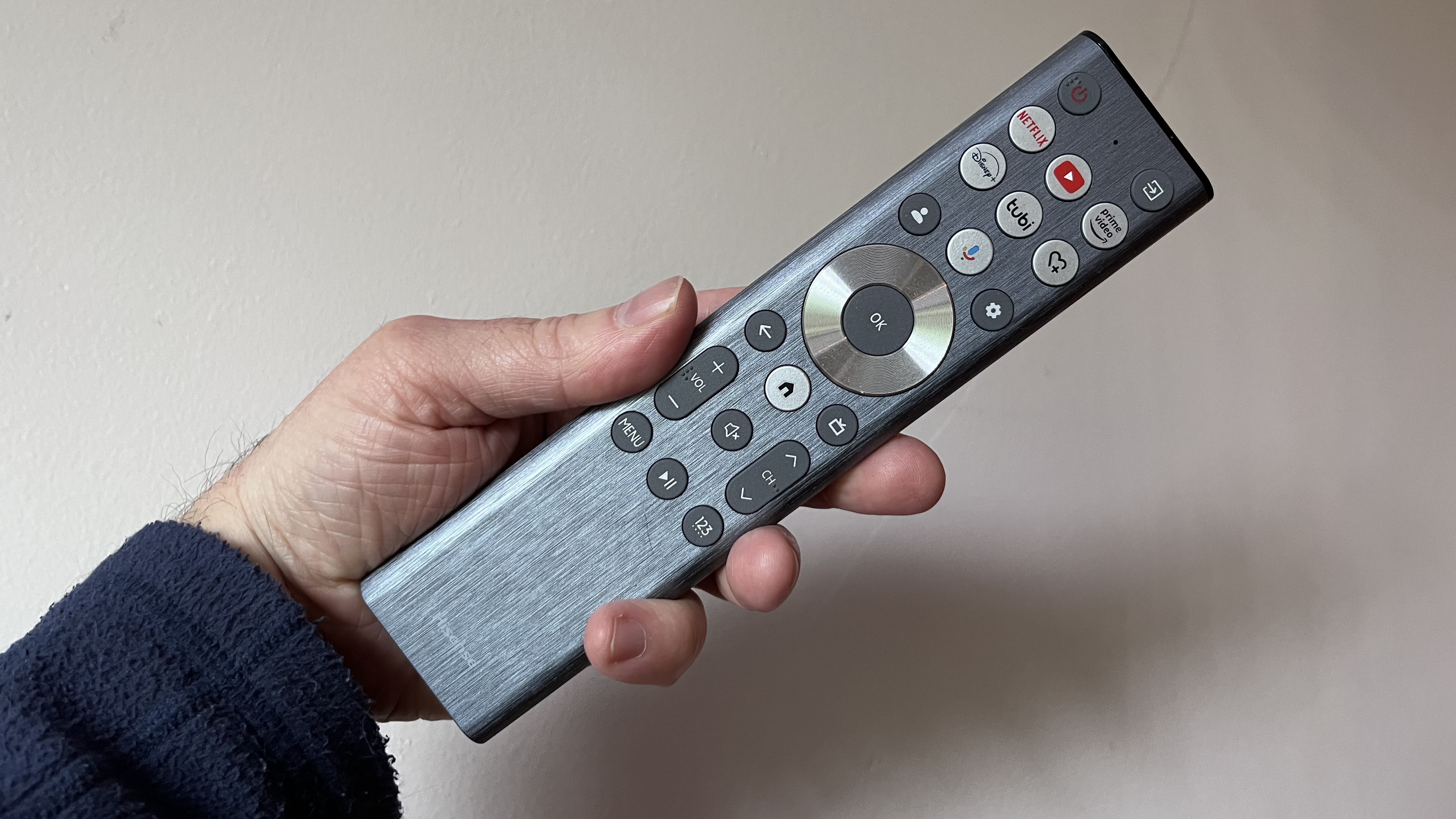 Hisense U8QG remote control held in hand