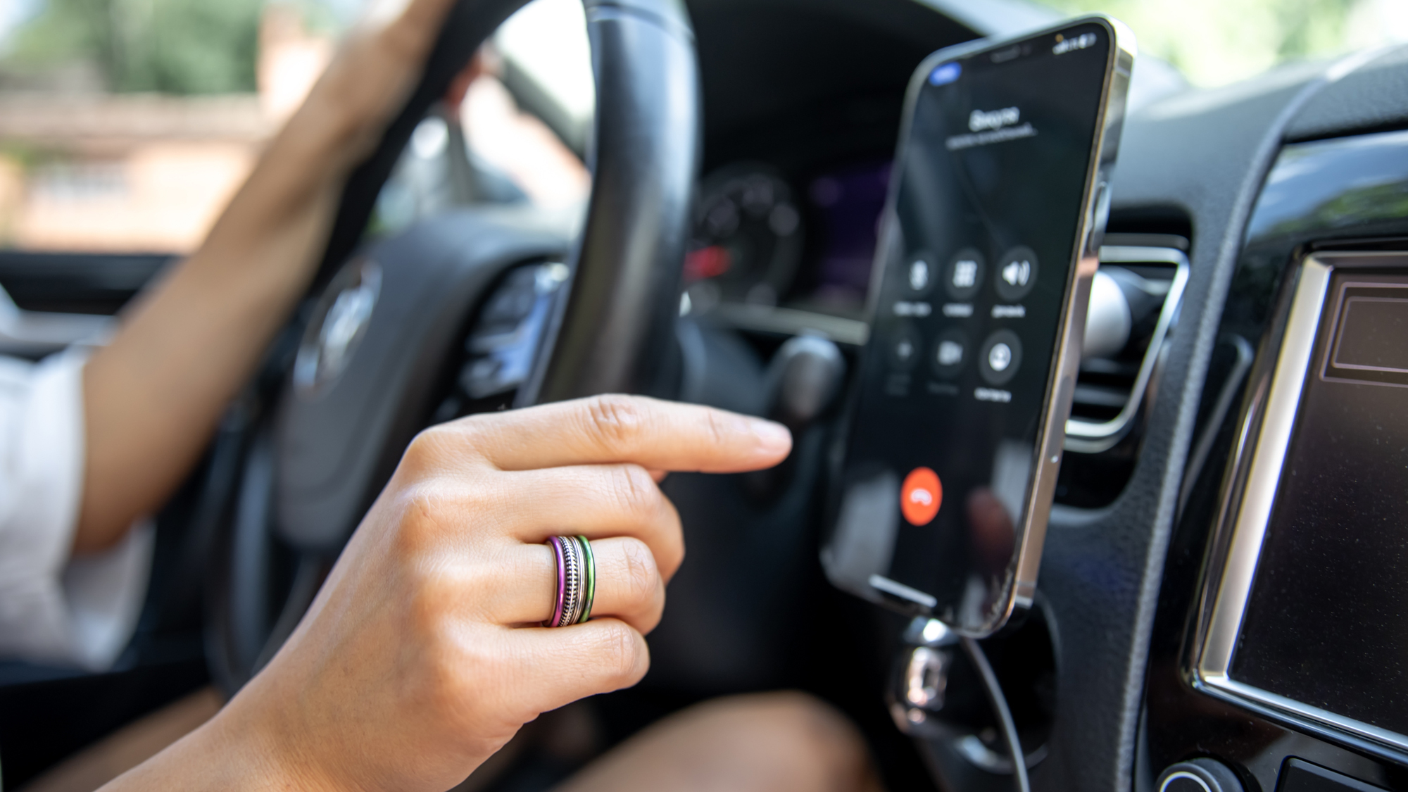 iPhone on the dashboard of a car
