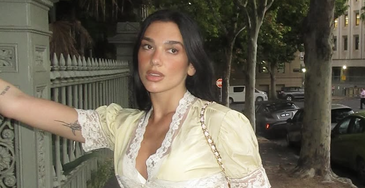 dua lipa on instagram wearing a lace dress and a chanel bag