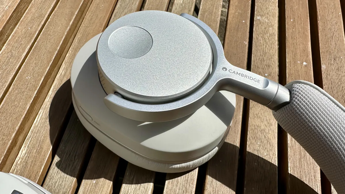 Cambridge Audio Melomania P100 headphones on a wooden surface