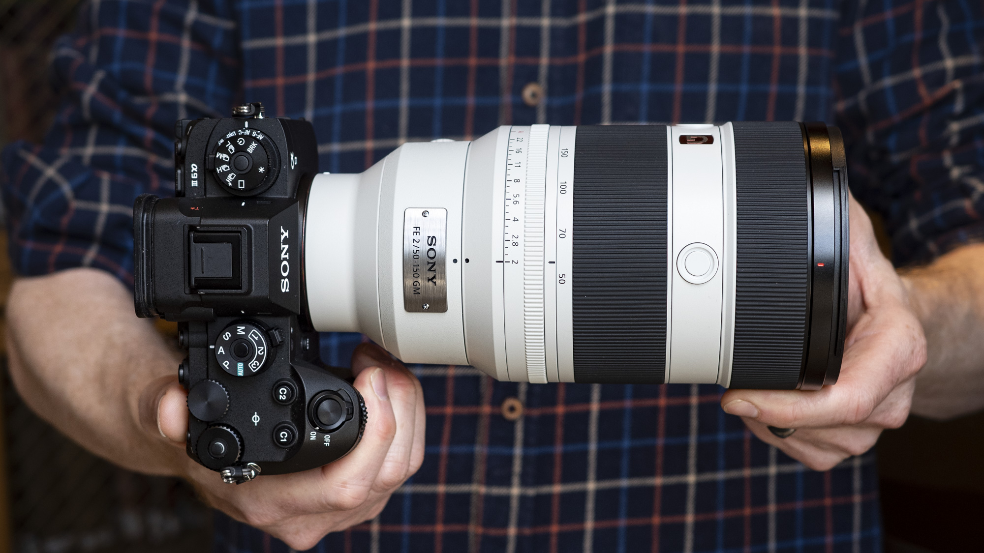 Sony FE 50-150mm F2 GM lens attached to a Sony A9 III, in the hand