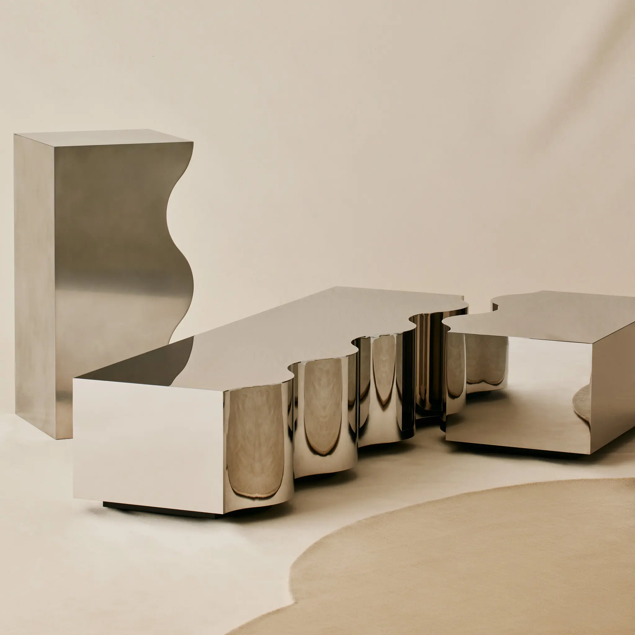 chrome coffee tables on beige backdrop