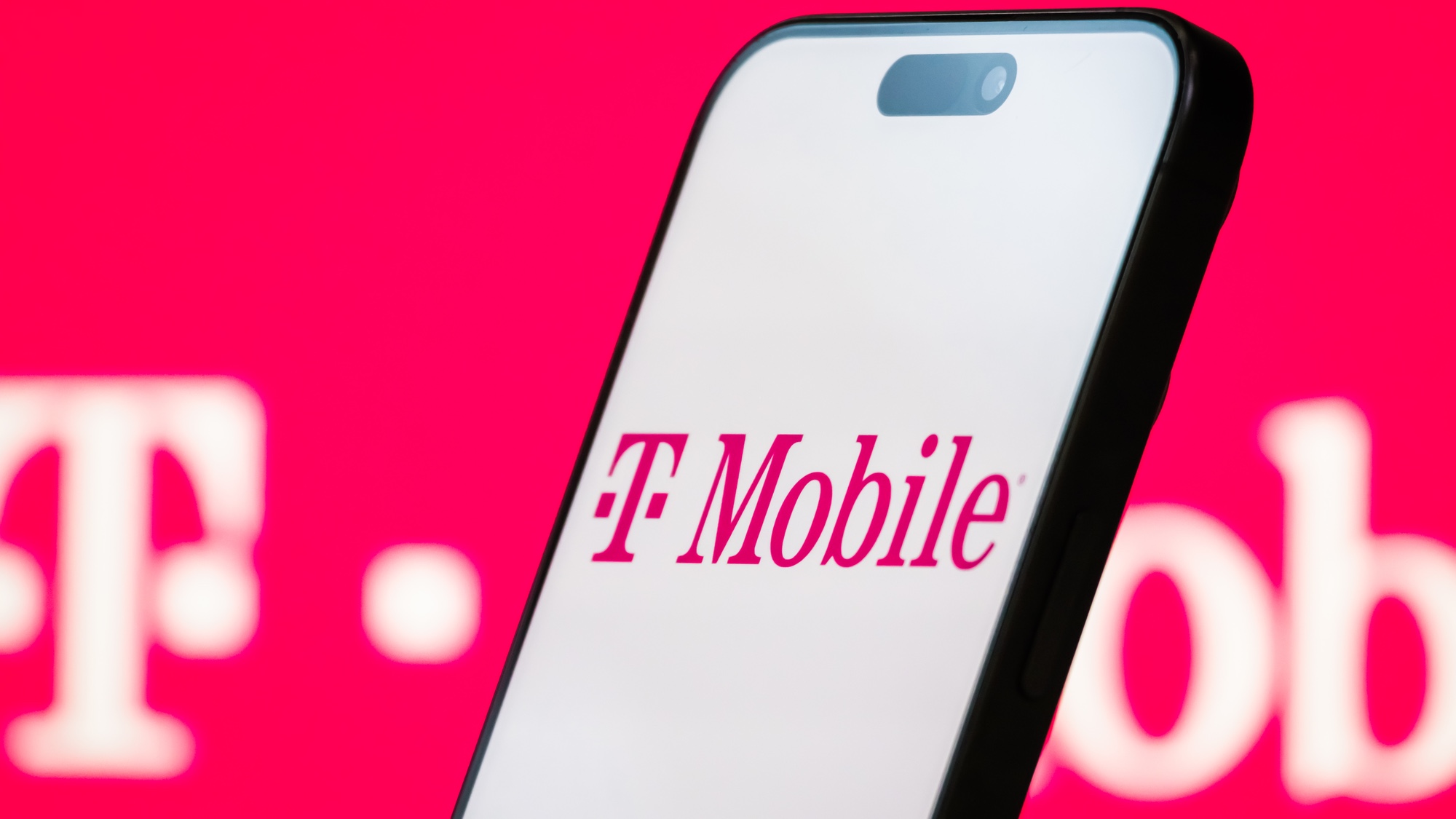 T-Mobile logo on a phone with a magenta background