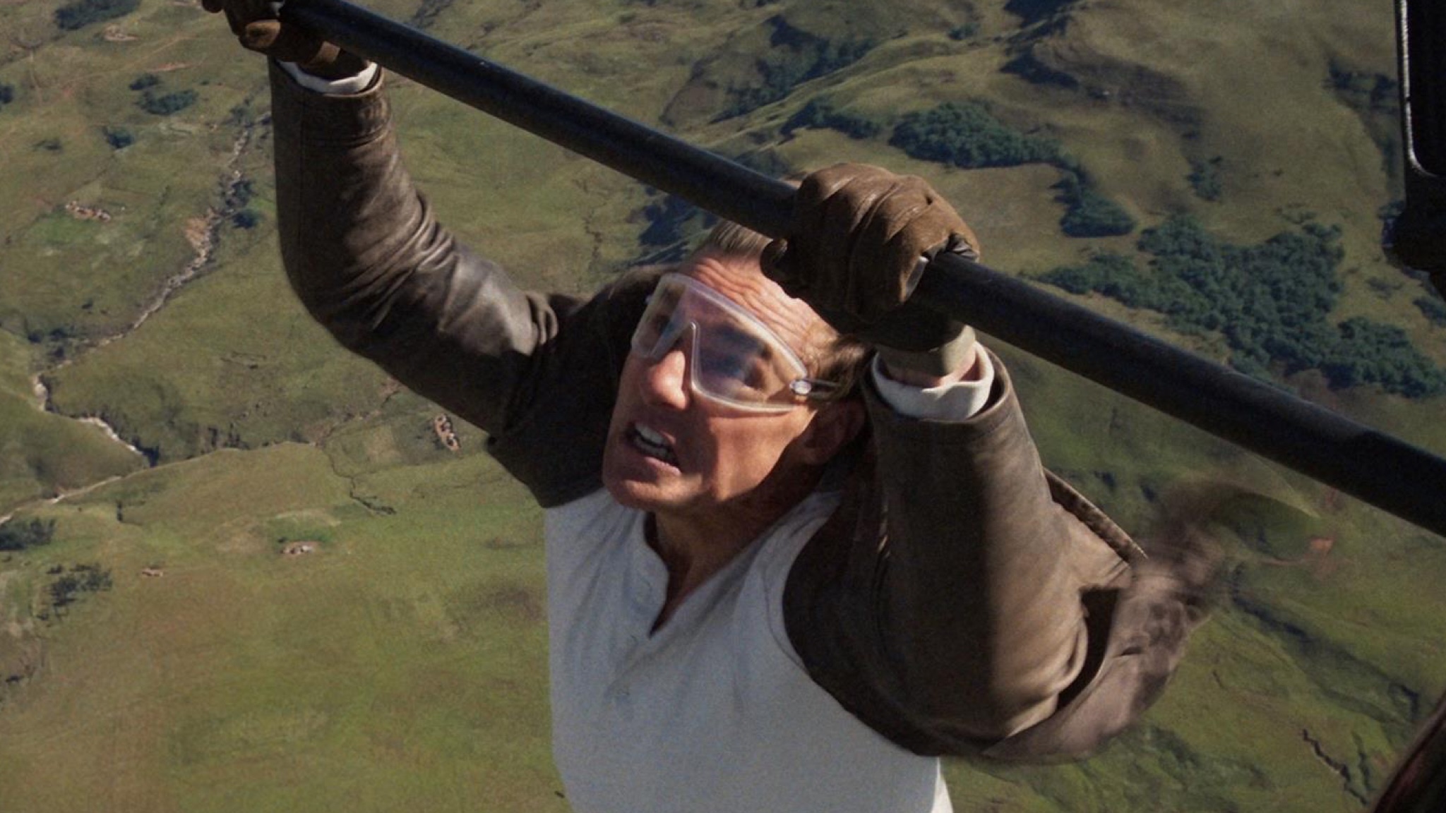 Tom Cruise swings from an aeroplane undercarriage in the final Mission Impossible movie