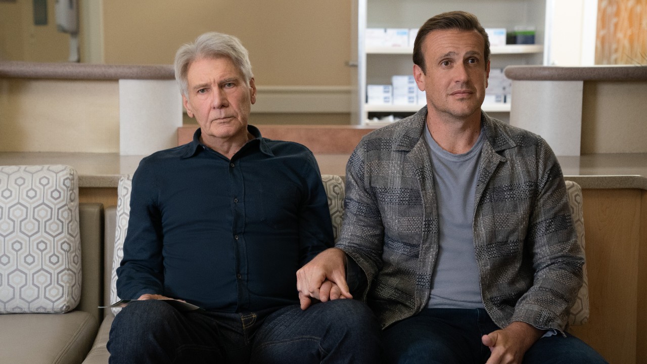 From left to right: Harrison Ford looking upset about the fact that he&#039;s holding Jason Segel&#039;s hand.