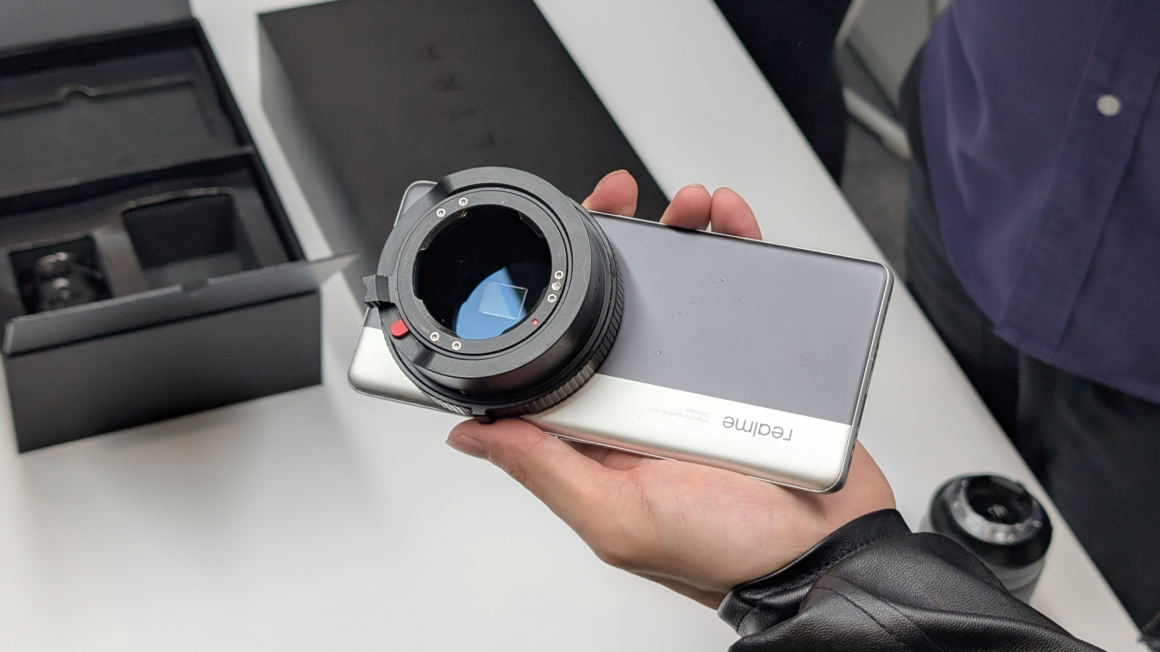 RealMe Interchangeable Lens Concept phone held in a hand