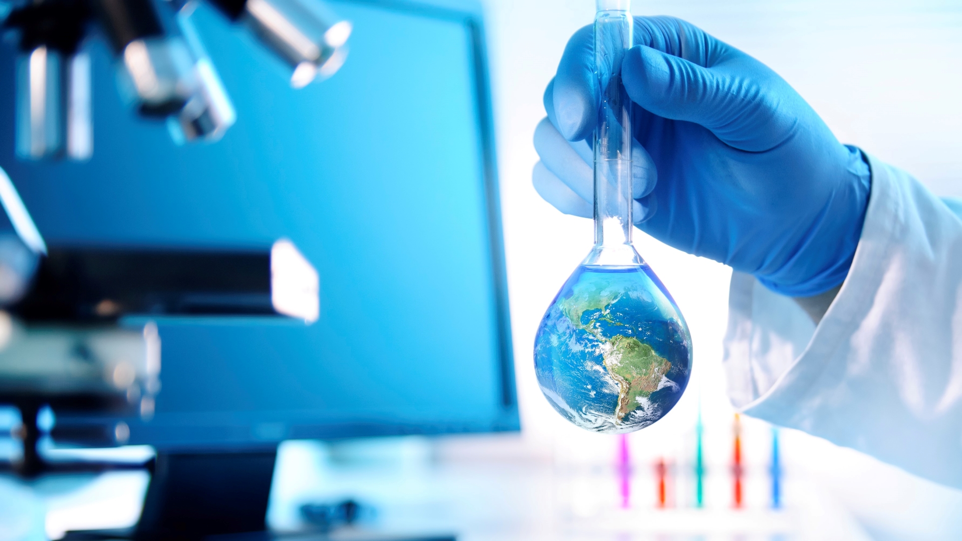 A composite image of a scientist holding a flask with the Earth inside.